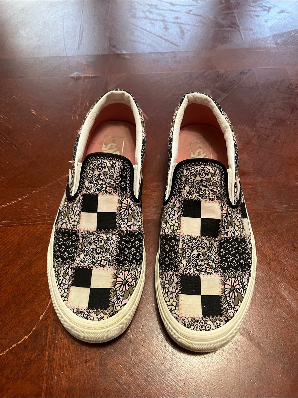 Vans Slip-On Checkerboard Floral Sneakers in Black and Pink